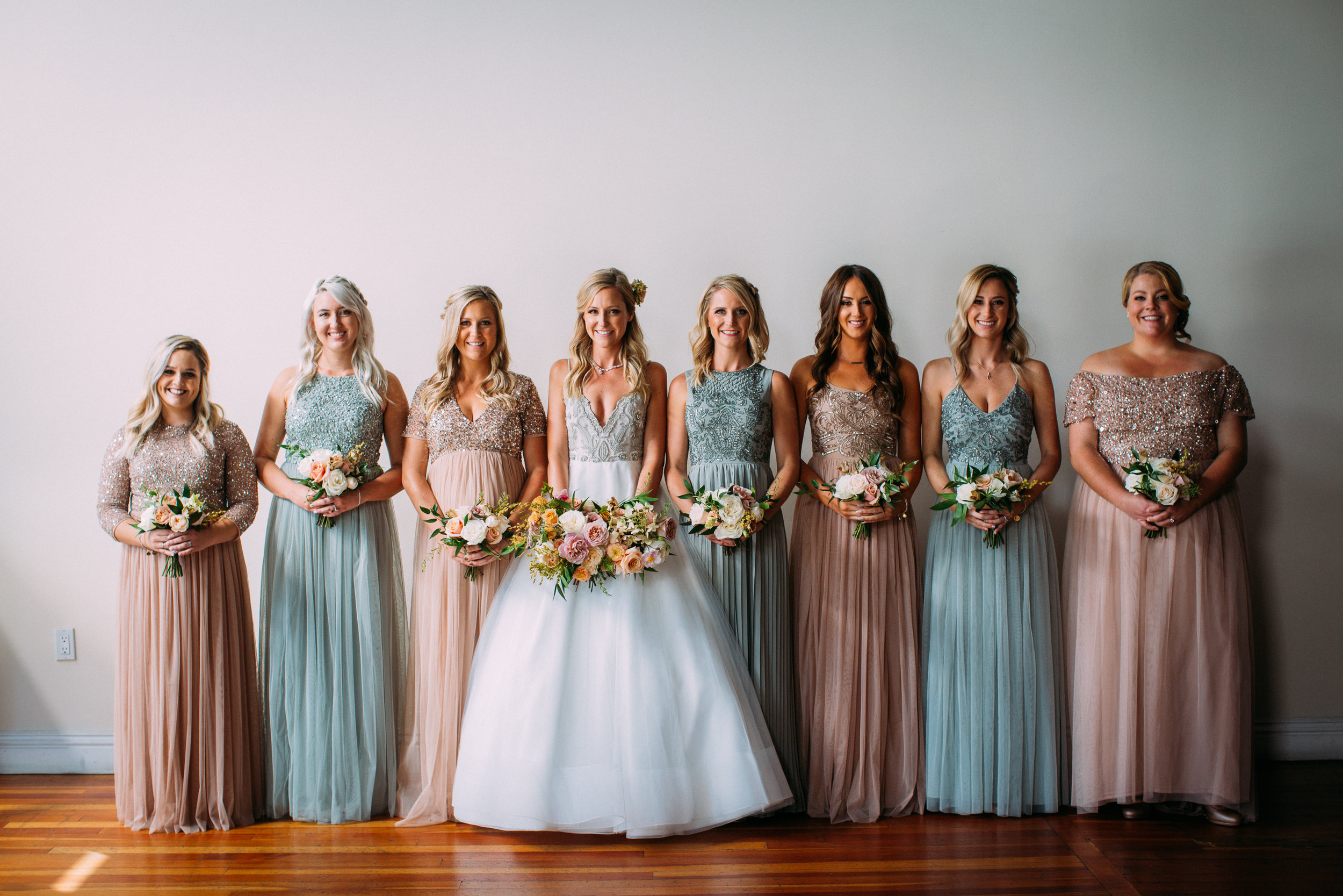 Bridal party with coordinated bouquets